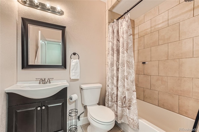 full bathroom with tile patterned floors, vanity, toilet, and shower / bath combo with shower curtain