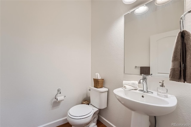 bathroom with toilet and sink