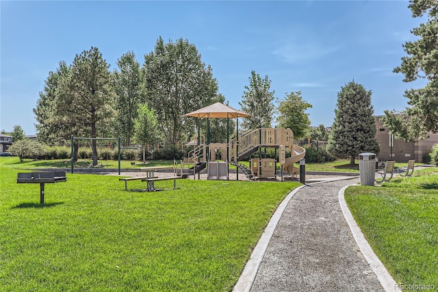 surrounding community with a lawn and a playground