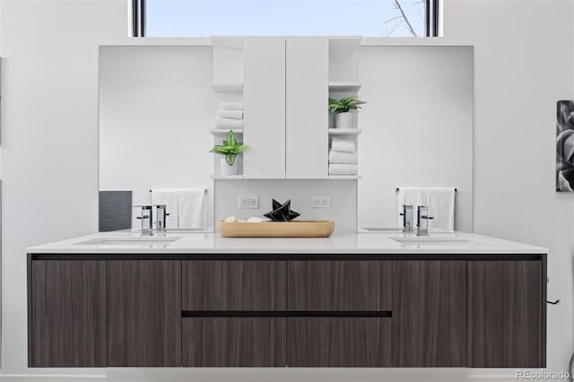 kitchen featuring white cabinets, a wealth of natural light, and dark brown cabinetry