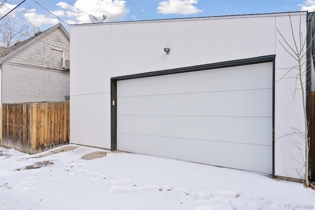 view of snow covered garage