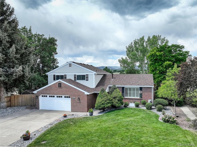 9356 W Geddes Pl, Littleton, CO 80128 - view of front of home featuring brick siding, driveway, roof with shingles, and a garage