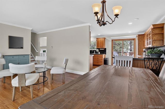 9356 W Geddes Pl, Littleton, CO 80128 - dining area with ornamental molding, a chandelier, wood finished floors, stairs, and recessed lighting