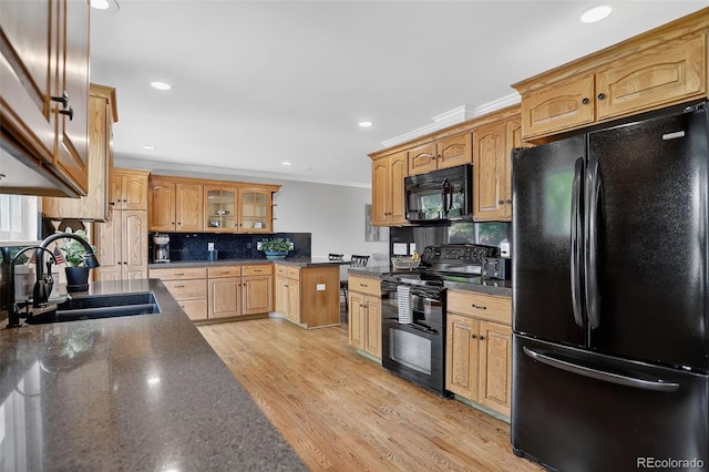 9356 W Geddes Pl, Littleton, CO 80128 - kitchen with black appliances, ornamental molding, glass insert cabinets, decorative backsplash, and recessed lighting