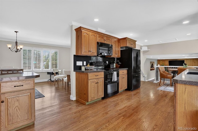 9356 W Geddes Pl, Littleton, CO 80128 - kitchen featuring black appliances, ornamental molding, recessed lighting, light wood finished floors, and dark countertops