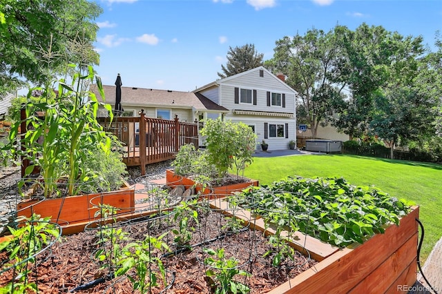 9356 W Geddes Pl, Littleton, CO 80128 - back of house with a hot tub, a vegetable garden, a yard, and a deck