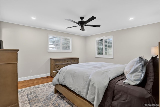 9356 W Geddes Pl, Littleton, CO 80128 - bedroom with wood finished floors, multiple windows, recessed lighting, ornamental molding, and ceiling fan