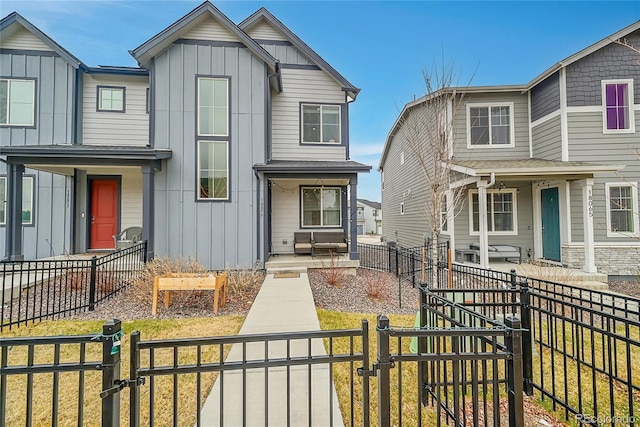 18059 French Creek Ave, Parker, CO 80134 - view of front of house with a gate, board and batten siding, and a fenced backyard