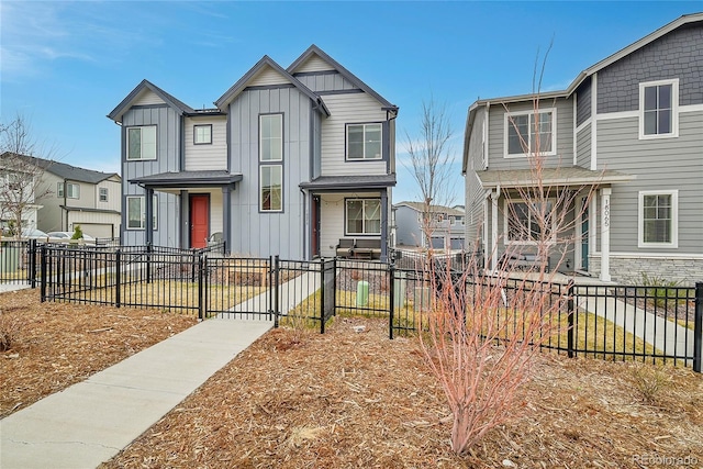 18059 French Creek Ave, Parker, CO 80134 - view of front facade featuring board and batten siding, a gate, a residential view, and a fenced front yard