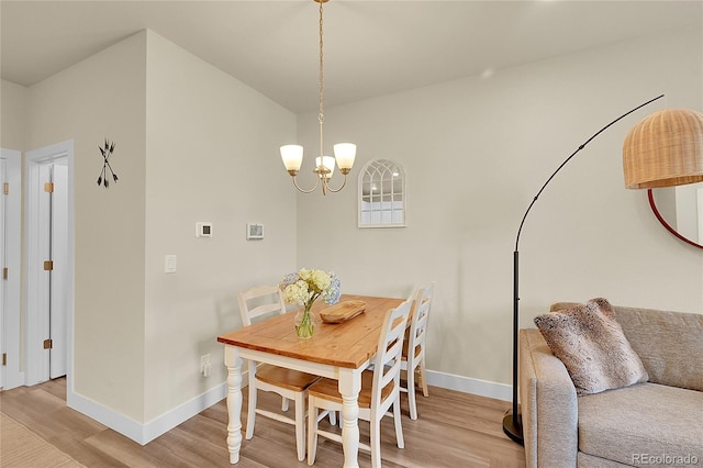 18059 French Creek Ave, Parker, CO 80134 - dining room with baseboards, a chandelier, and light wood-type flooring