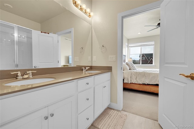 18059 French Creek Ave, Parker, CO 80134 - bathroom featuring tile patterned floors, a sink, double vanity, and ensuite bathroom