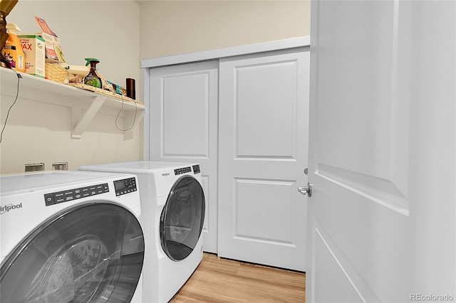 18059 French Creek Ave, Parker, CO 80134 - laundry room featuring light wood-type flooring, independent washer and dryer, and laundry area