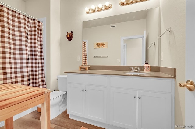 18059 French Creek Ave, Parker, CO 80134 - full bathroom featuring wood finished floors, toilet, and vanity