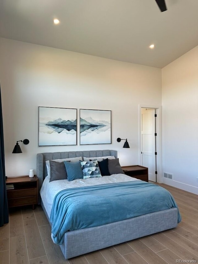 bedroom featuring wood-type flooring and ceiling fan