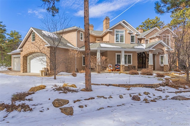 view of front of home with a garage and covered porch