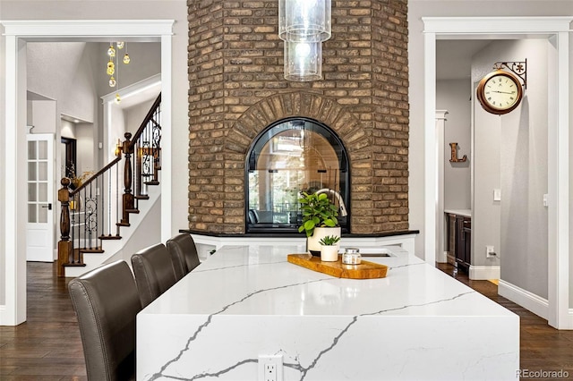 dining area featuring dark wood-type flooring