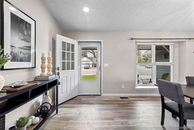 20908 E Dorado Cir, Centennial, CO 80015 - doorway to outside with a textured ceiling, wood finished floors, baseboards, and recessed lighting