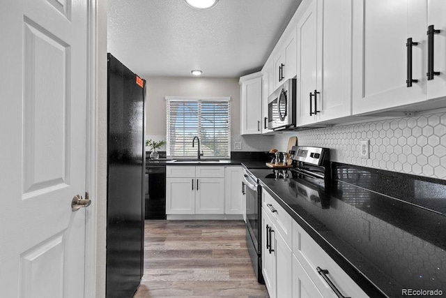 20908 E Dorado Cir, Centennial, CO 80015 - kitchen with black appliances, a sink, white cabinets, a textured ceiling, and light wood-style flooring