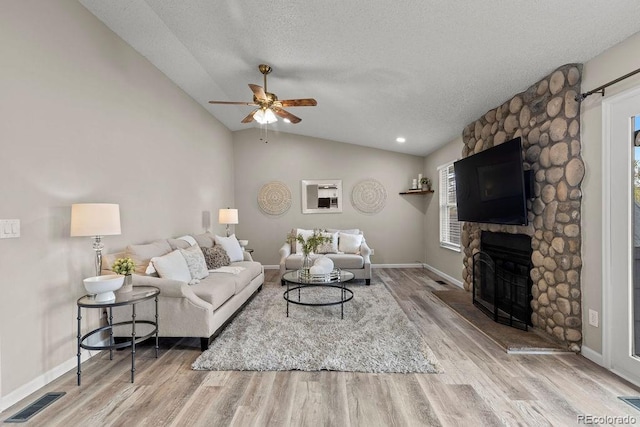 20908 E Dorado Cir, Centennial, CO 80015 - living area featuring a ceiling fan, wood finished floors, lofted ceiling, a textured ceiling, and baseboards