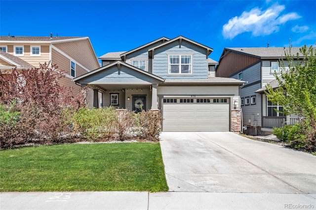 476 Hyde Park Cir, Castle Pines, CO 80108 - craftsman-style home with concrete driveway, a front yard, a garage, and stone siding