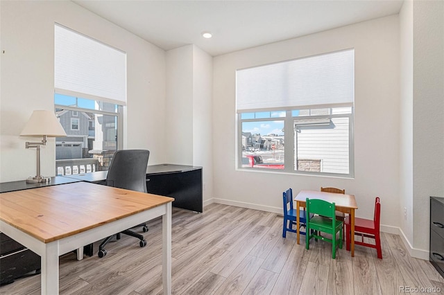 office with light hardwood / wood-style floors