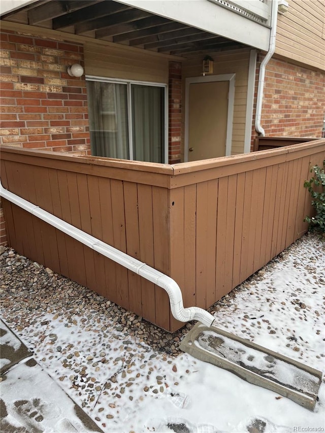 view of property exterior with brick siding