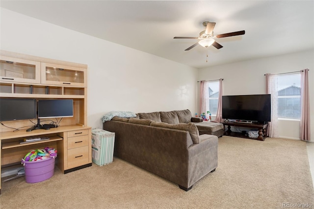 living room with light carpet and ceiling fan