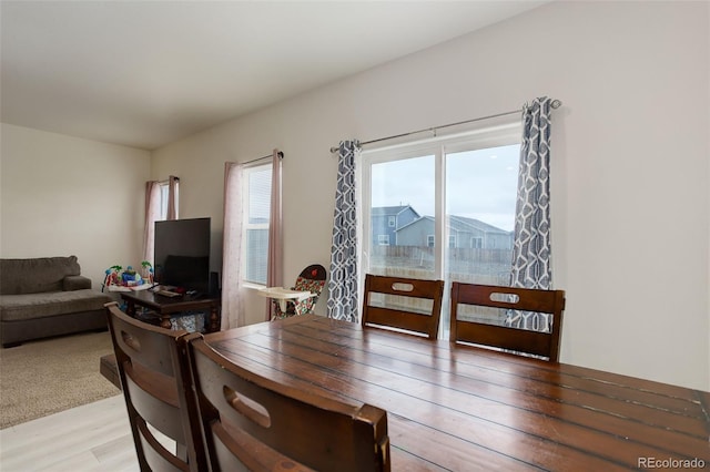 dining room with light wood-style flooring