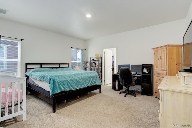 bedroom featuring recessed lighting and light colored carpet