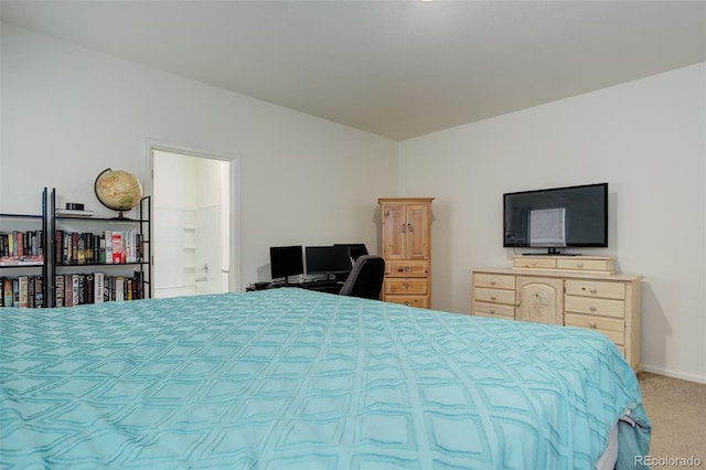 bedroom featuring carpet and baseboards