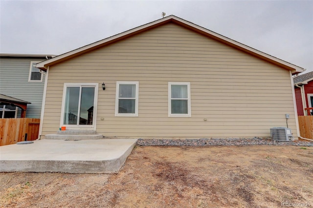 back of property with entry steps, a gazebo, a patio area, and fence