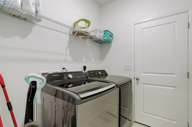 laundry area with washing machine and dryer and laundry area