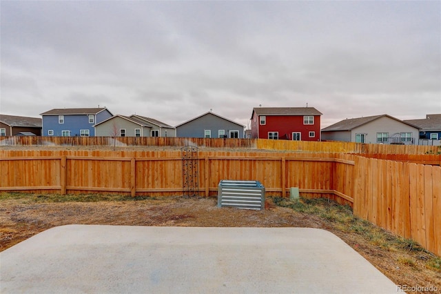 view of yard with fence and a patio