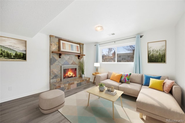 living room featuring a fireplace and hardwood / wood-style floors