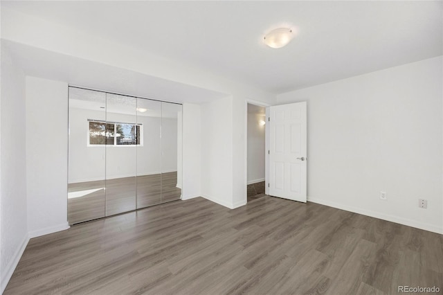 empty room featuring hardwood / wood-style flooring