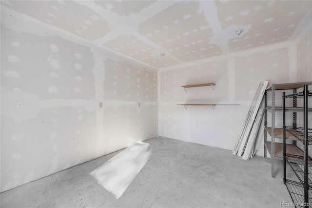 unfurnished room with concrete floors