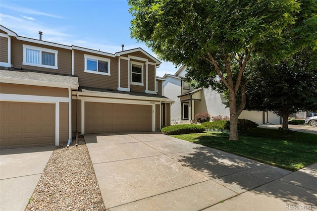 2430 E 109th Dr, Northglenn, CO 80233 - view of front of home with an attached garage, concrete driveway, and a front yard