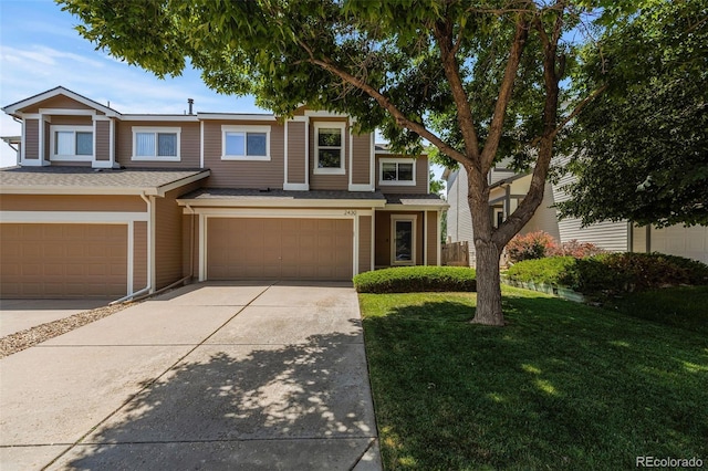 2430 E 109th Dr, Northglenn, CO 80233 - view of front facade featuring an attached garage, concrete driveway, and a front lawn