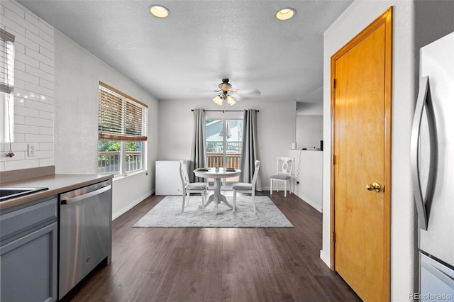 2430 E 109th Dr, Northglenn, CO 80233 - dining space with ceiling fan, dark wood-type flooring, a textured ceiling, and recessed lighting