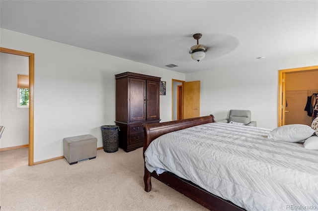 2430 E 109th Dr, Northglenn, CO 80233 - bedroom featuring light colored carpet, a walk in closet, and ceiling fan