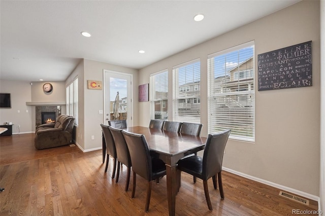 19760 W 59th Dr, Golden, CO 80403 - dining space featuring wood finished floors, a high end fireplace, and recessed lighting
