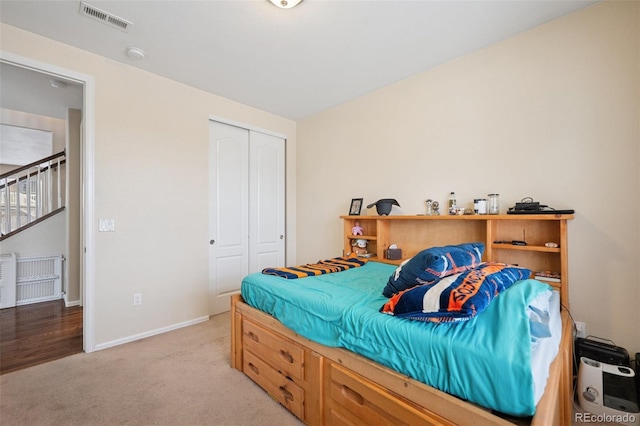 19760 W 59th Dr, Golden, CO 80403 - bedroom with light colored carpet and a closet