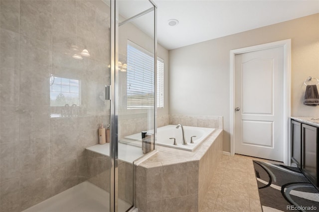 19760 W 59th Dr, Golden, CO 80403 - bathroom featuring a garden tub, a stall shower, tile patterned floors, and vanity