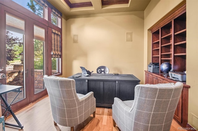 office area with light hardwood / wood-style flooring, french doors, and coffered ceiling