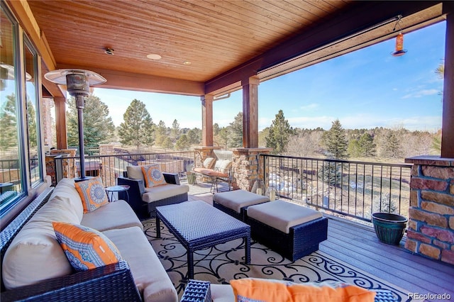 view of patio with a balcony and an outdoor living space