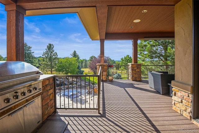 exterior space with grilling area and an outdoor kitchen