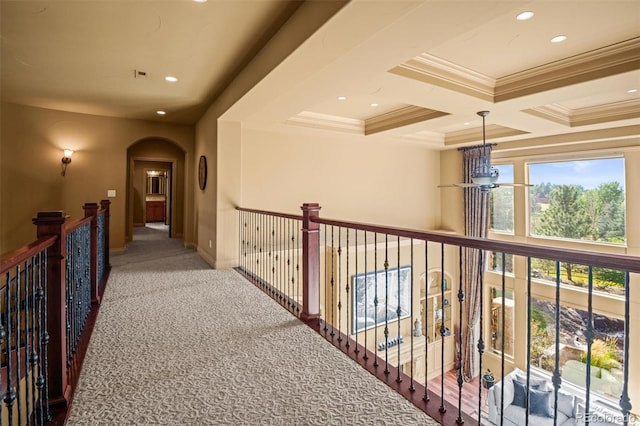 hallway with coffered ceiling, crown molding, carpet floors, and beam ceiling