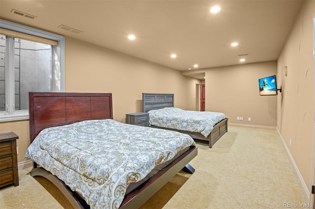 bedroom featuring light colored carpet