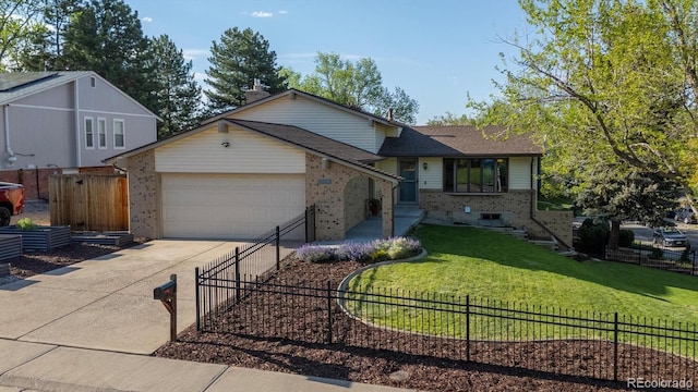 10909 W 65th Way, Arvada, CO 80004 - split level home featuring brick siding, an attached garage, and driveway