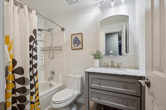 10909 W 65th Way, Arvada, CO 80004 - bathroom with vanity, toilet, shower / tub combo with curtain, and tasteful backsplash